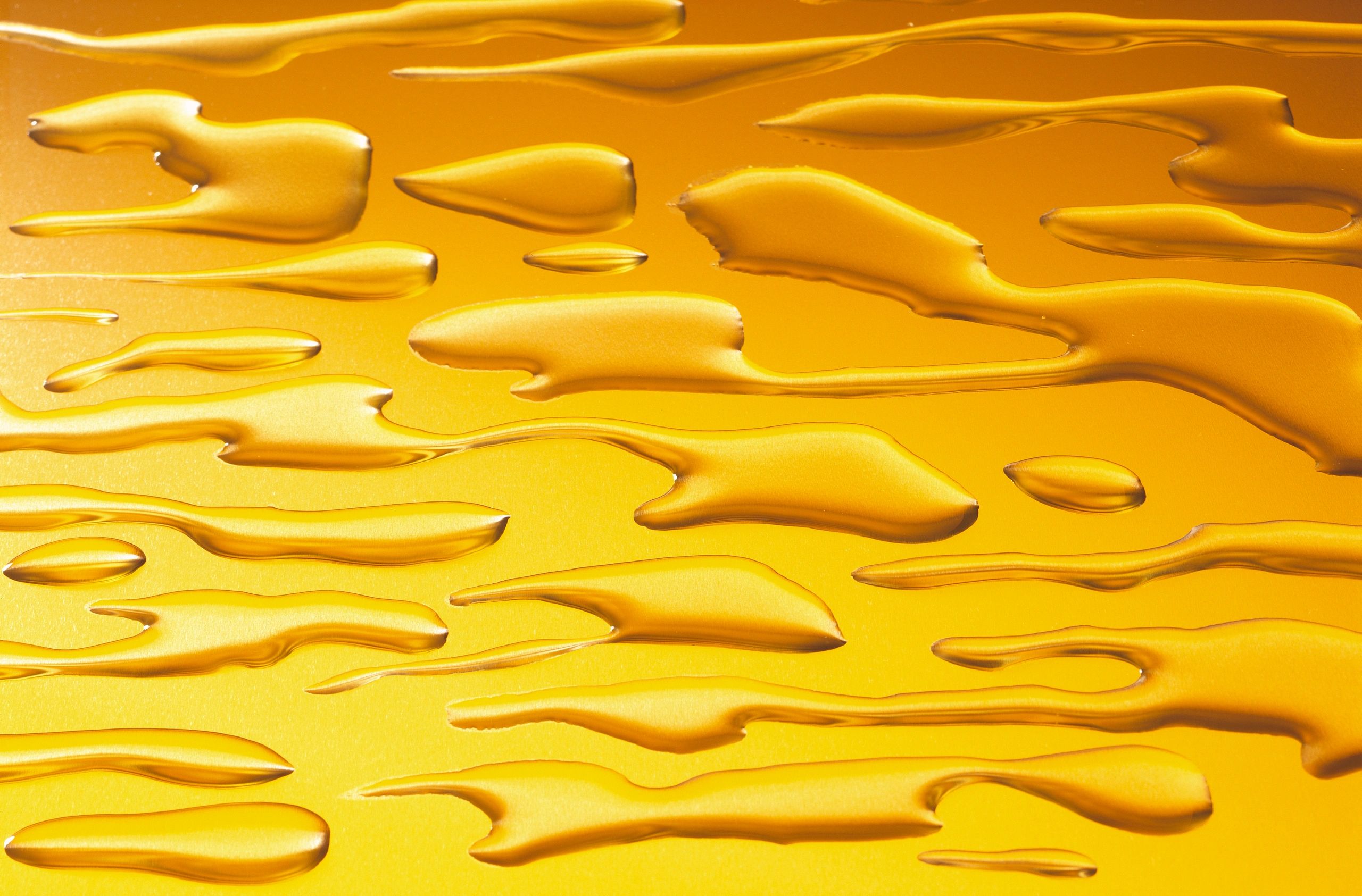 Abstract oil texture on gold background