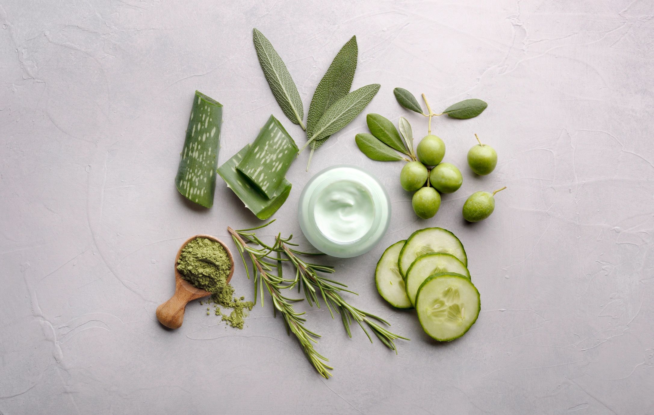Skincare ingredients and moisturizer arranged neatly
