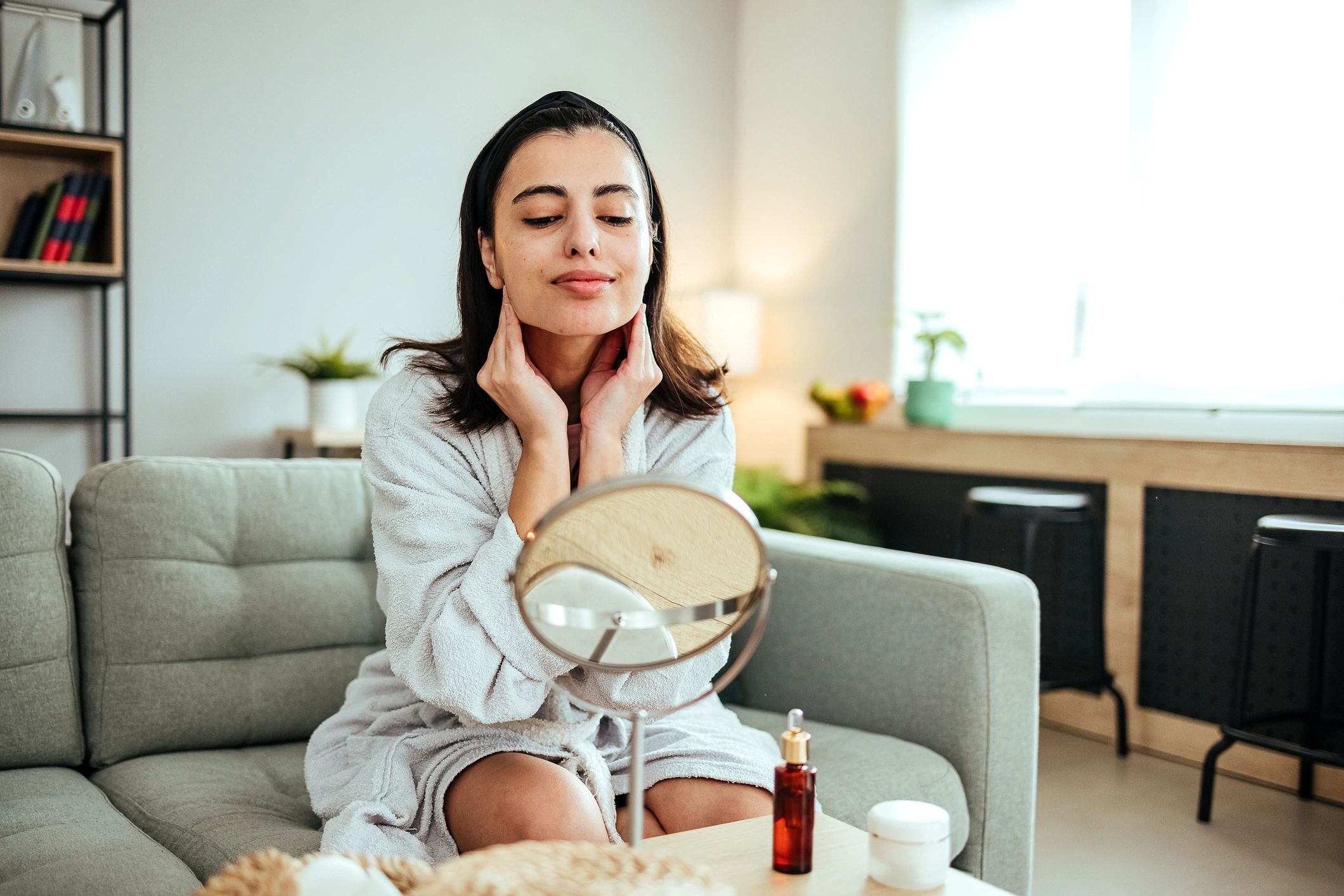 Woman massaging her face during a skincare routine