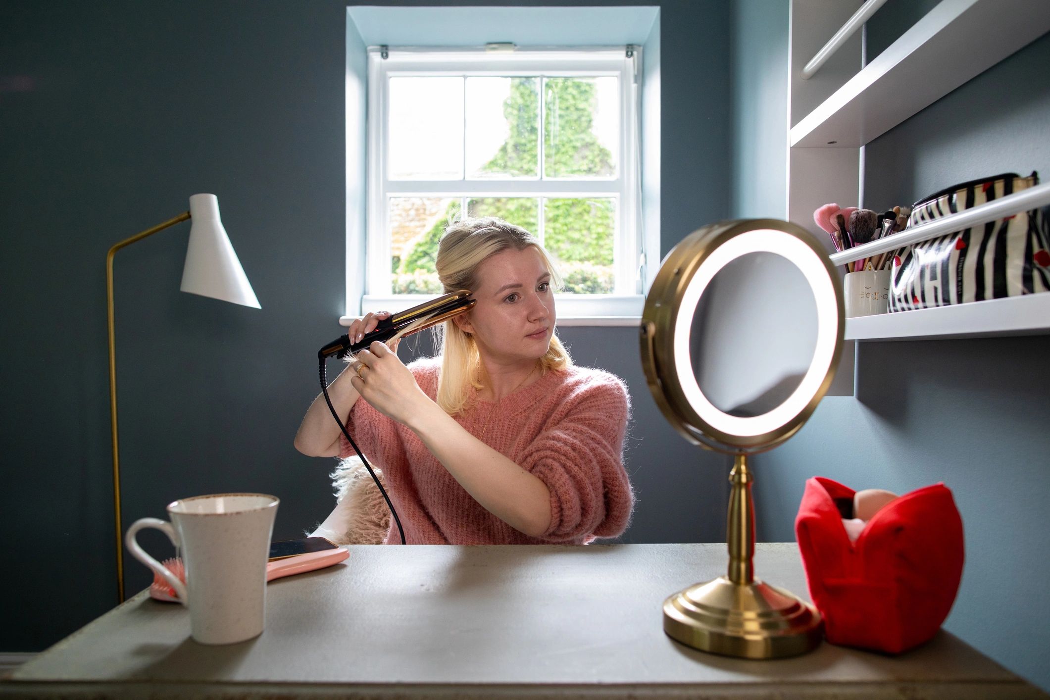 Woman using a beauty device at home