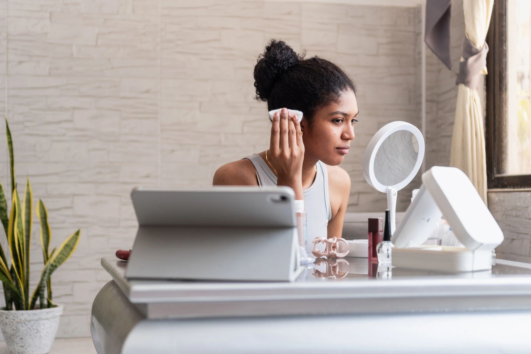 Woman following a skincare routine at home