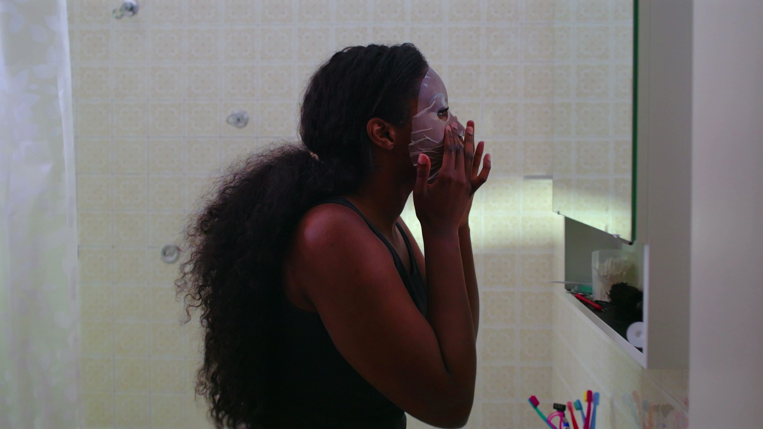 Woman doing a skincare routine at home